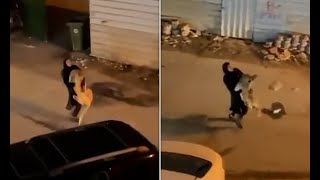 Brave women carries an escaped Lion down the street in Kuwait