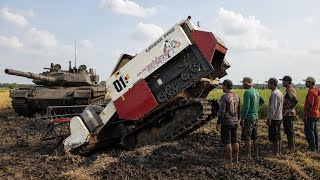 Laskar Padi 01 combine harvester moves to a new field in the evening
