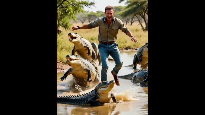 Brave man runs through crocodile infested water!