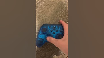 Pushing buttons on blue Xbox controller satisfying ￼