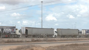 Aid trucks queue near Kerem Shalom border crossing to enter Gaza | AFP