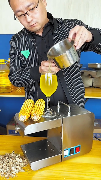 Oil production process from corn and groundnut