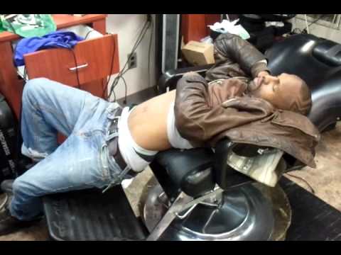 Man sleeping in barber chair