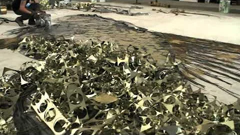 Quais os materiais usados por Vik Muniz em suas obras?