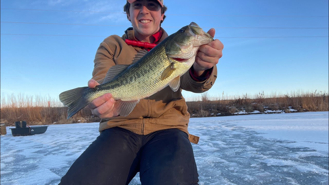 INSANE BASS FISHING THROUGH THE ICE!!