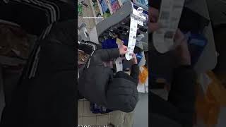 Burglar dangles through hole in supermarket ceiling