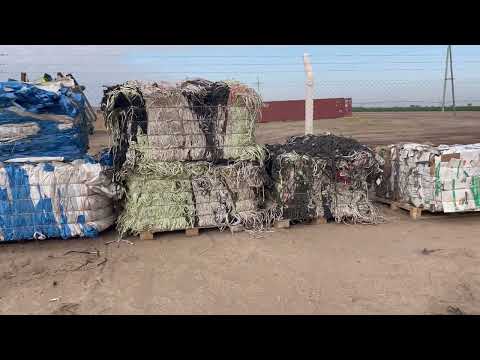 Watch - compressed pallets of waste ready for recycling centre