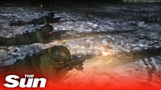 Russia's newly-enlisted soldiers fire rifles at night in stealth exercises