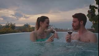 Couple Drinking Wine And Blowing Kisses In A Hot Tub Stock Video Footage Artgrid Io