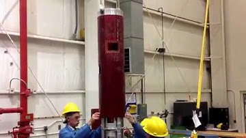 Lowering rocket skin over 2014 RockSatC forward payloads. Mitchell CC top payload