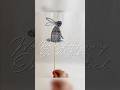 A woven bunny on a stick