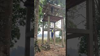 Resting at a watch tower after cycling in the jungle