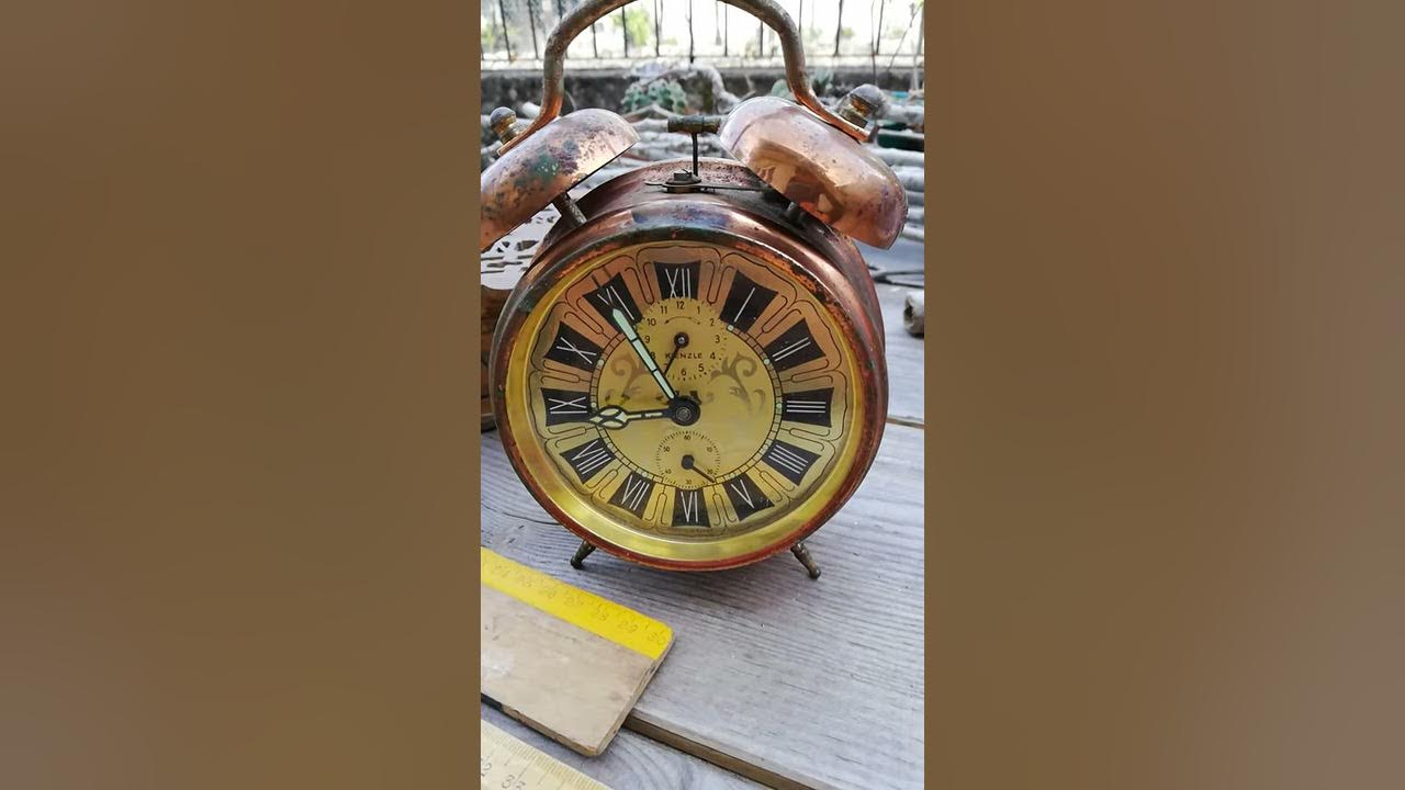 Vintage alarm clock working. Also a lot of birds singing