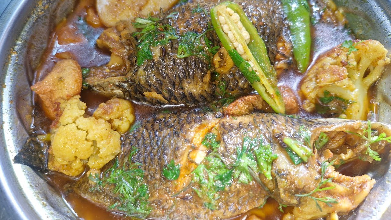 এতো বড়ো কৈ মাছ দিয়ে। আজকে রান্না হলো কৈ মাছের ঝাল 