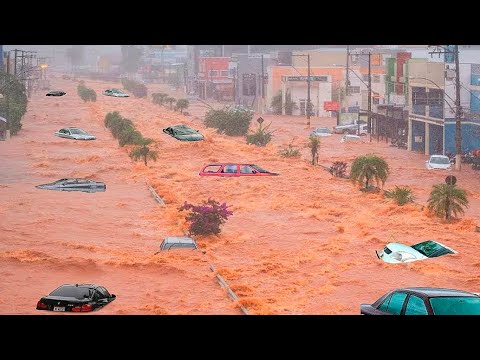 A devastating flood sweeps cars and buildings away in Barretos, São Paulo, Brazil