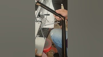 Small wrapping and pressing machine for the windows on the rigid boxes and hardcovers