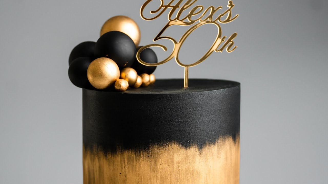 Classic Black And Gold Cake With Gold Ornaments