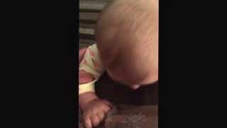 Funny baby doing raspberries on the couch!