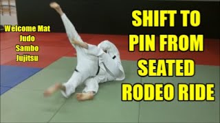 SHIFT TO PIN FROM SEATED RODEO RIDE