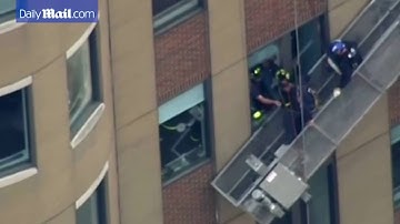 Firefighters rescue window washers after platform collapse