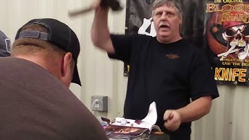 Sharpening Swiss army knife, Hatchet, Battle axe and matches at the Orlando Florida gun show