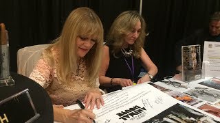 Martha Smith signing "Animal House" poster