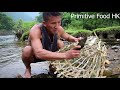 Primitive life : Survival skills fish trap technology , Catch big catfish by the river