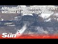 Aerial footage shows Japan aircraft wreckage as investigations start