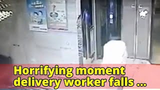 Horrifying moment delivery worker falls down a lift shaft after the doors opened but the elevator wa
