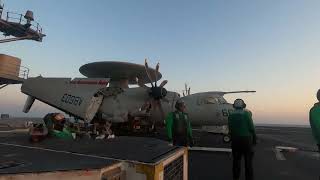 Sunset F18 wire catch onboard USS HARRY S. TRUMAN