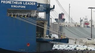 car carrier PROMETHEUS LEADER 9VHE9 IMO 9338888 roro cargo ship embarking export cars in Emden