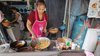 Thai Food Stall Owner and Hardworking Assistant  Cooked Fried Rice Sardines