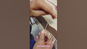 create a hem by tying fabric threads