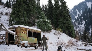 Iron shelter in the mountains, an old wagon, abandoned place, Winter shelter