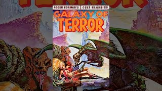 A terrifying alien creature emerges from darkness in the Galaxy of Terror game poster