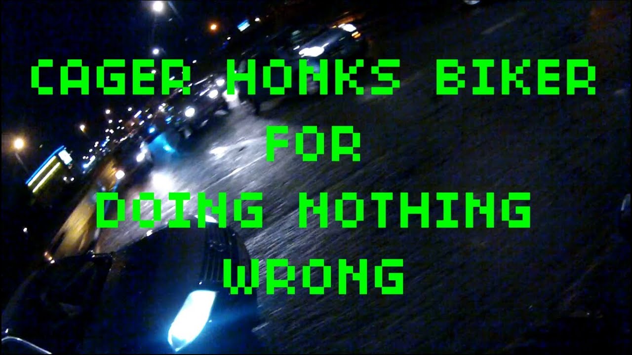 Angry Cager honks biker for doing nothing wrong!