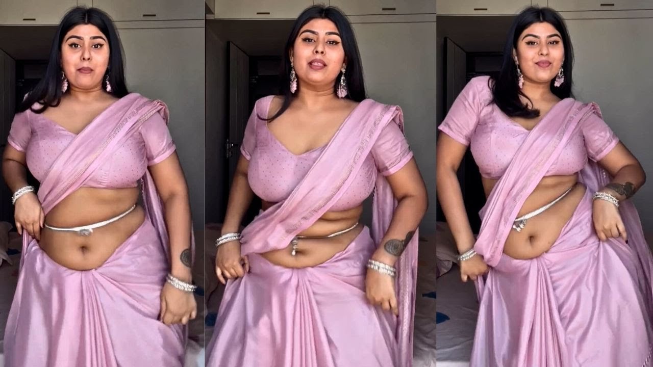 Low Hip Saree Draping Style Peach Satin Silk Saree Paired with Low Open Neck Blouse