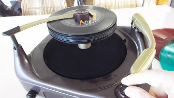 Voice of Music 3 speed automatic record player playing a stack of 45