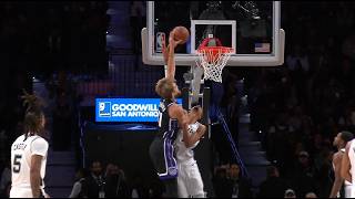 Domantas Sabonis misses a powerful dunk attempt over Wembanyama, who receives a forearm to the face