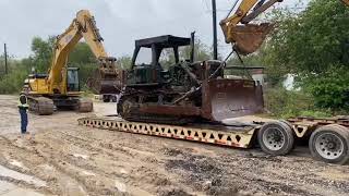 Offloading Cat D7G with cat 345BL and Cat 320CL excavator