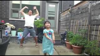 Riley performing with Daddy as a background dancer