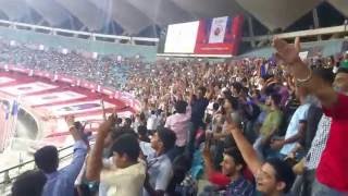 Delhi Dynamos fans do the Mexican Wave.
