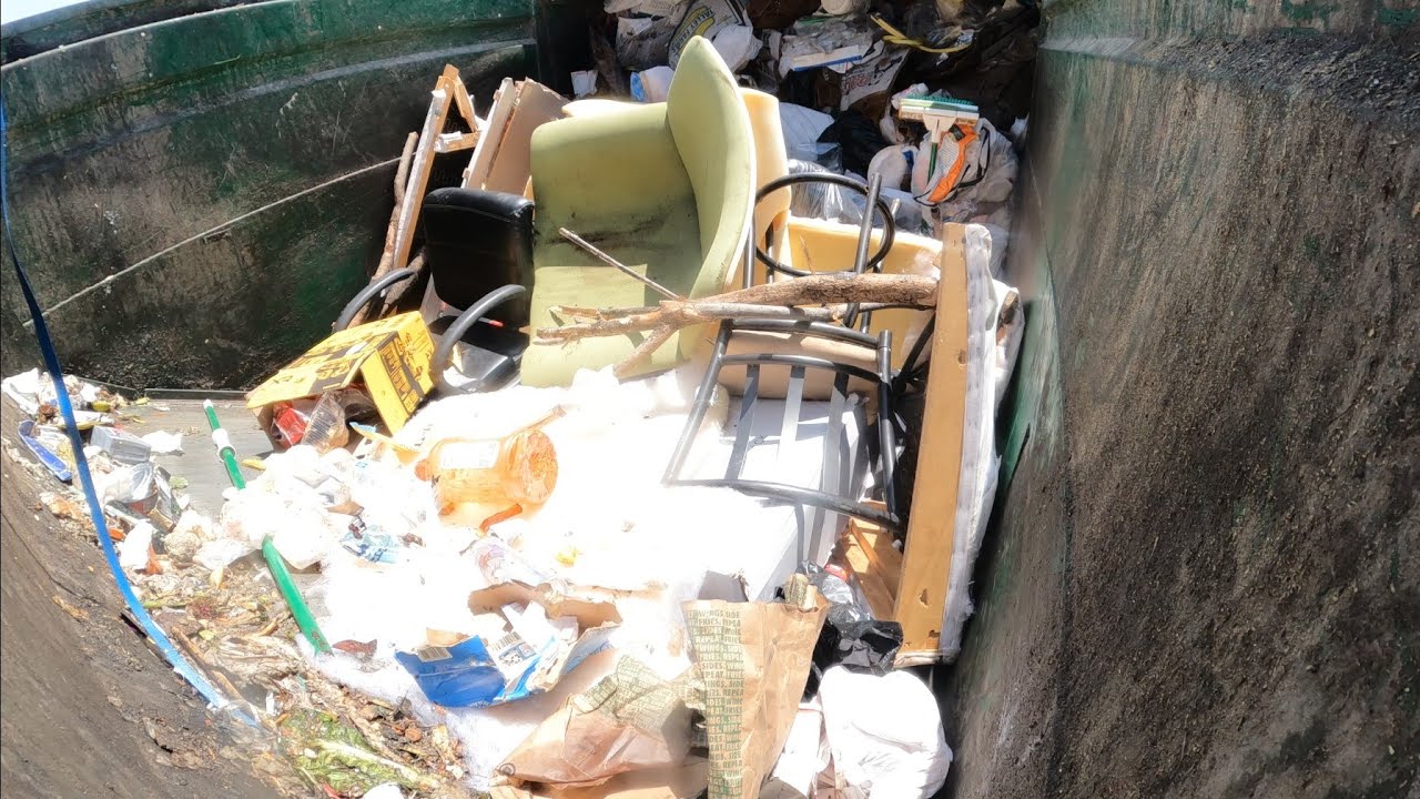 Waste Management front load garbage truck hopper view