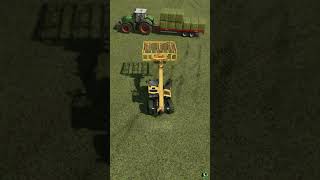 Stacking Hay Bales Onto A Red Rock Trailer