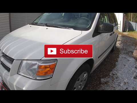 Video: Si e fikni zilen e rripit të sigurimit në një Dodge Caravan 2014?