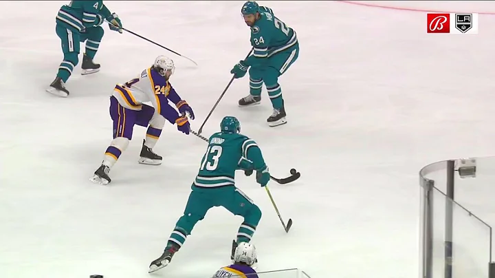 Phillip Danault skates by Shark defenders before p...