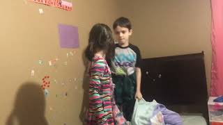 Boy attempt to punch girl then she ducks and boy falls off bed
