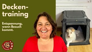 Deckentraining oder Boxentraining mit deinem Hund, so dass Besuch entspannt begrüßt werden kann.