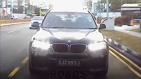 SJZ893J failed to stop at zebra crossing with a cyclist crossing.