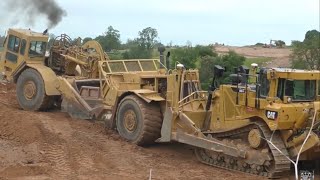 Caterpillar D8T Dozer Push Loading Caterpillar 627F Scraper